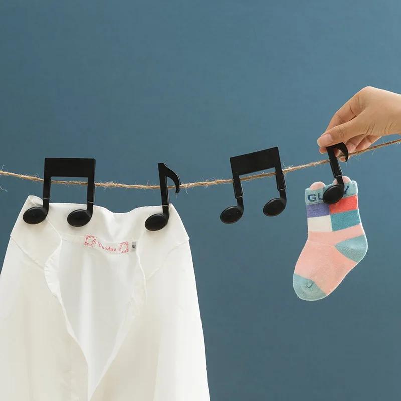 مشبكان للملابس على شكل نوتة مو - مراجعة Baby Clothing Drying Rack وسعره