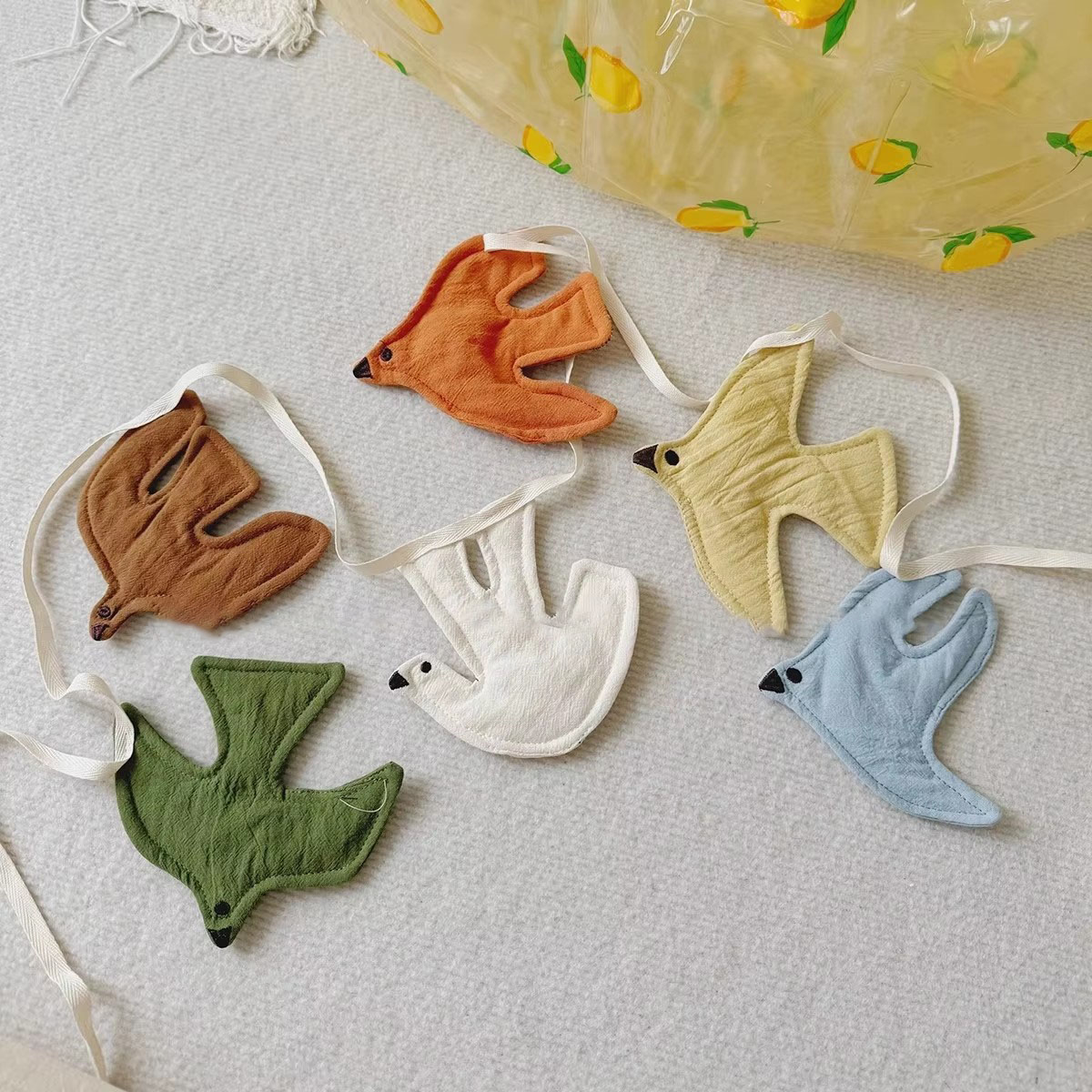 أعلام قماشية على شكل طيور لتزي - مراجعة Baby Clothing Material وسعره
